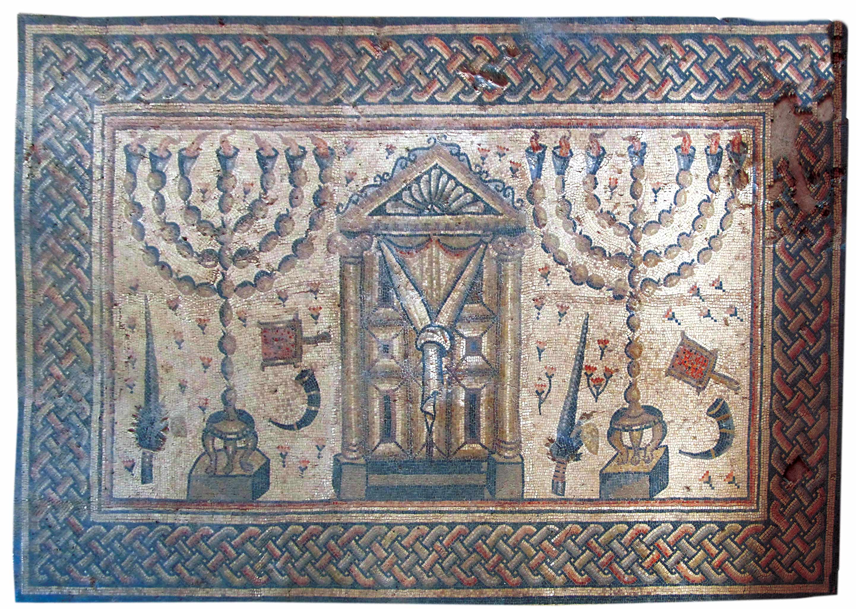 Shofars figure prominently in ancient synagogue mosaics. In this fragment from Hamat Tiberias, found in 1921 and dated to the third or fourth century, two shofars appear among the four species, seven-branched menoras, and coal pans surrounding what may represent the Temple façade