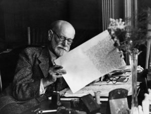Freud reviewing the manuscript of Moses and Monotheism, his next-to-last work, in London in 1938. Returning to the subject of religion, which he’d examined much earlier in his career, Freud identifies the faith of Moses as none other than the monotheistic revolution of Pharaoh Akhnaten, then suggests that rebellious Jews killed their leader and created Judaism out of guilt