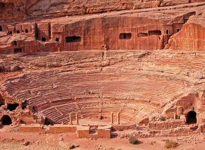 The classical Greek style of Petra’s theater – built under Roman rule – indicates outside influences, but the local red stone makes the structure unique