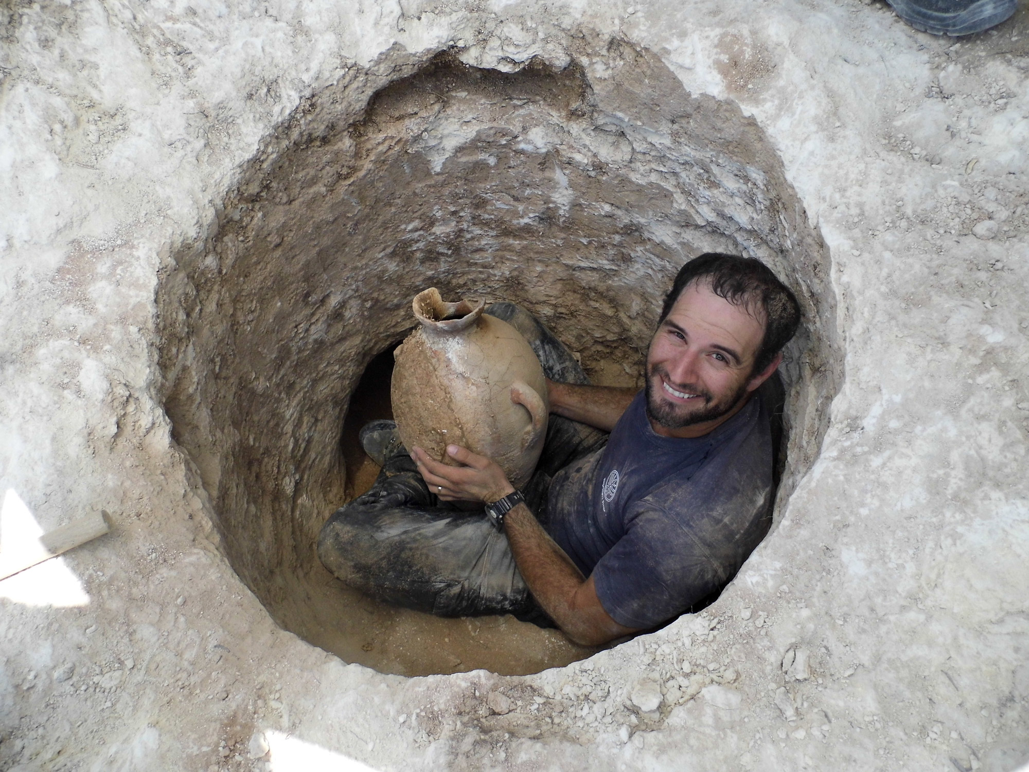 Alex Wigman presents a bowl removed from the ancient tomb