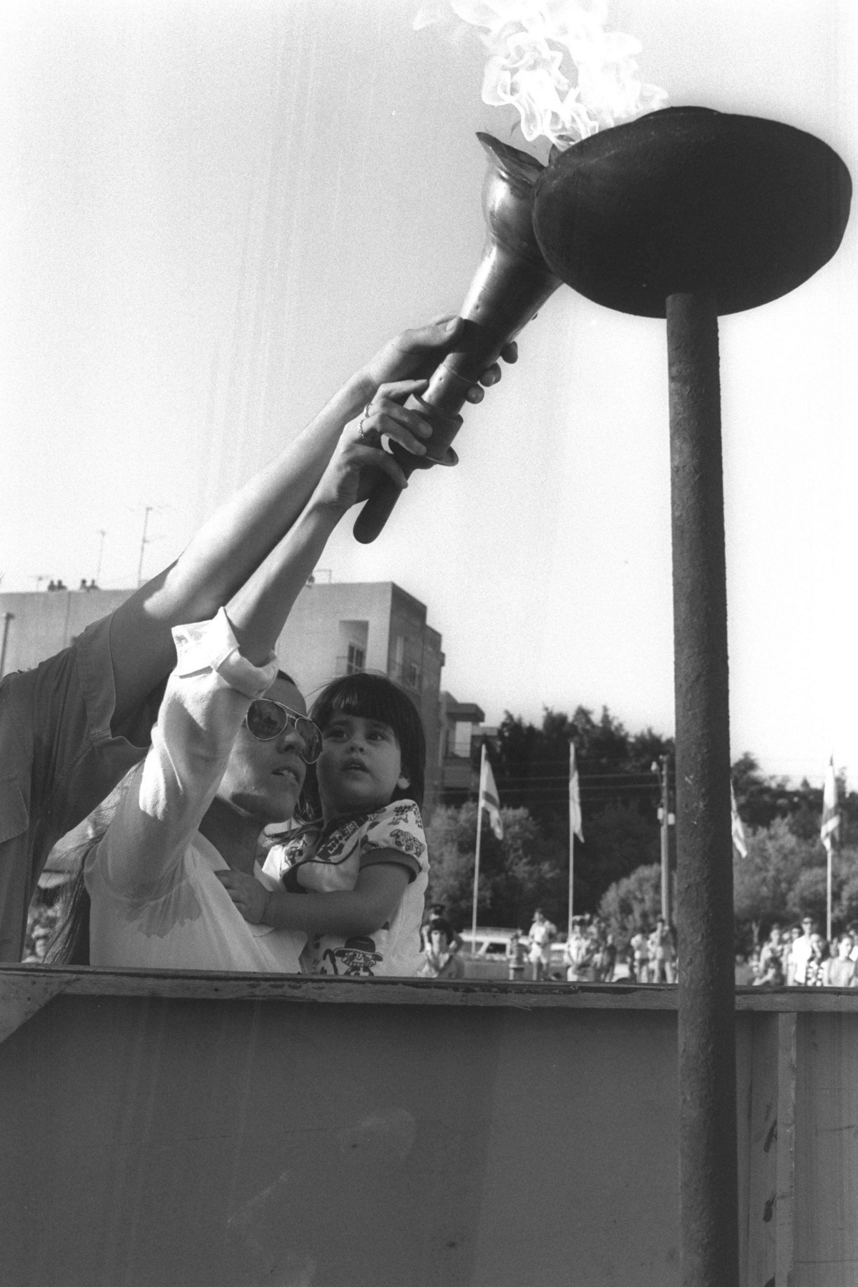 Widow of Andre Spitzer, coach of the Israeli fencing team, lighting a torch at the memorial service of 1974