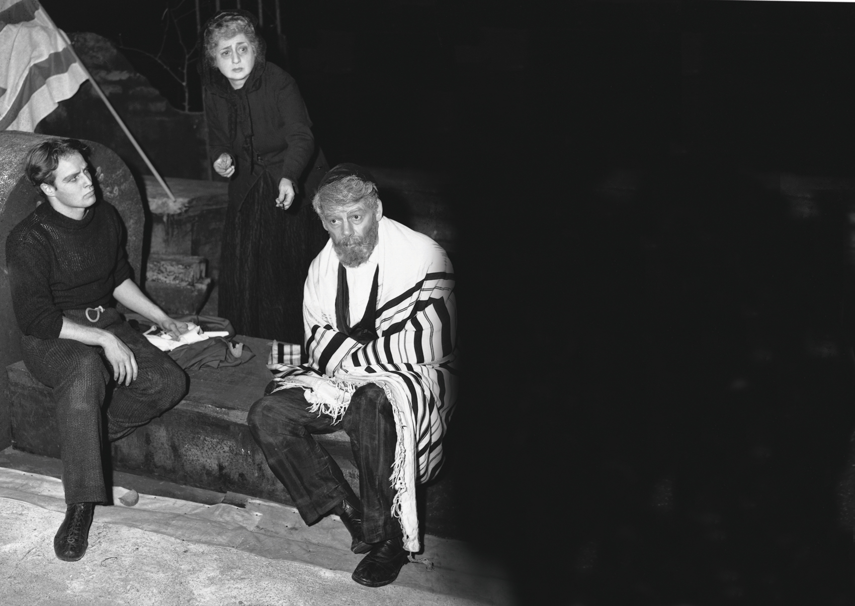 Everyone involved in A Flag Is Born had rallied to Ben Hecht’s call, and many volunteered their services. Celia Adler, first lady of the Yiddish stage, played the heroine alongside Paul Muni and Marlon Brando. Muni (left), Adler, and Brando rehearse before opening night