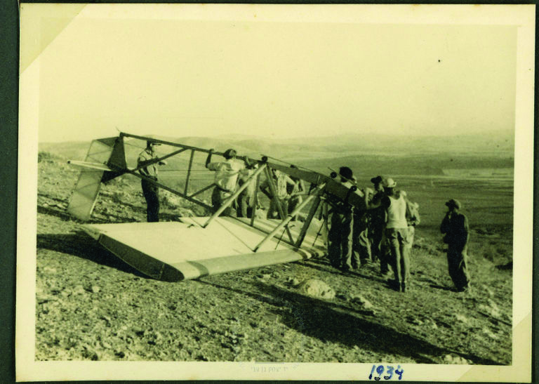 Members of the Israel Flight Club with an overturned glider at Kfar Ha-yeladim, near Afula, 1934
