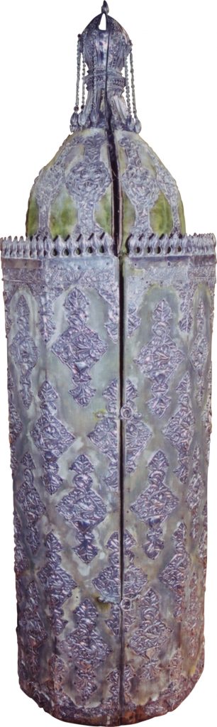 The inscription adorning the crown of the Sephardic Torah casket (wood covered with silver-inlaid velvet) states that the scroll was written in 1868 (5628)