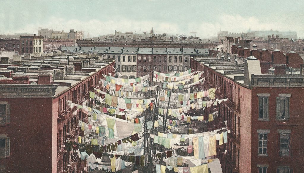 Tenement yard in the heart of New York, 1910. New immigrants and underprivileged transplants from other parts of the U.S. have transformed once Jewish neighborhoods into crime-ridden areas. Only recently have housing prices begun rising due to overcrowding elsewhere in the city