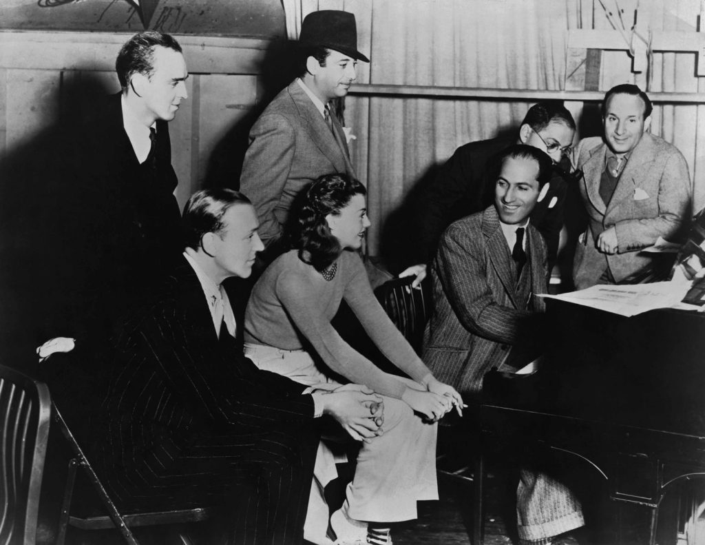  Gershwin at the piano with Fred Astaire, Ginger Rogers and musical directors of Shall We Dance, 1937, just months before his death that July