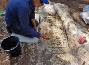 cleaning the mosaic inscription