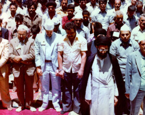 Promoted from the Islamic Revolution’s senior leadership to succeed Khomeini after his death in 1989. Ayatollah Ali Khamenei leading Friday prayers, 1979 | Photo: iichs.ir