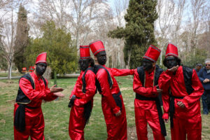 Revelers disguised as Amu Nowruz and Haji Firuz | Photo: N.smdz
